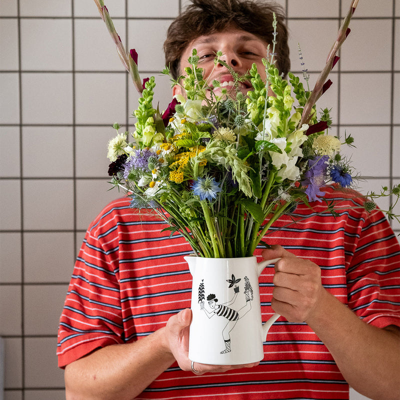 large jug balancing with plants